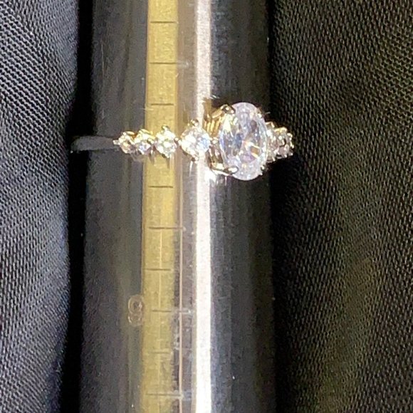 Silver Toned Ring with Oval Clear Stones With Eight Smaller Stones - Picture 12 of 12